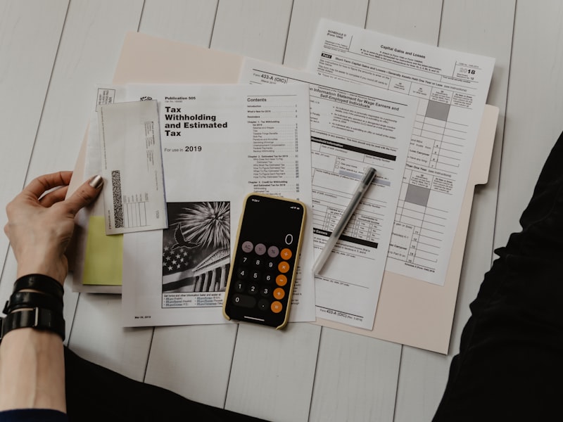 Filing a VAT return with calculator and documents